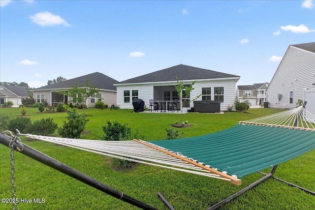 1673 White Starfish Ct, Calabash, NC 28467 - back of house with a lawn and a patio area