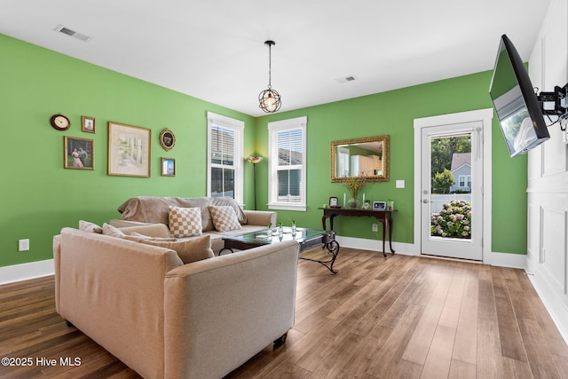 9154 Village Lake Dr SW, Calabash, NC 28467 - living area with healthy amount of natural light and wood finished floors
