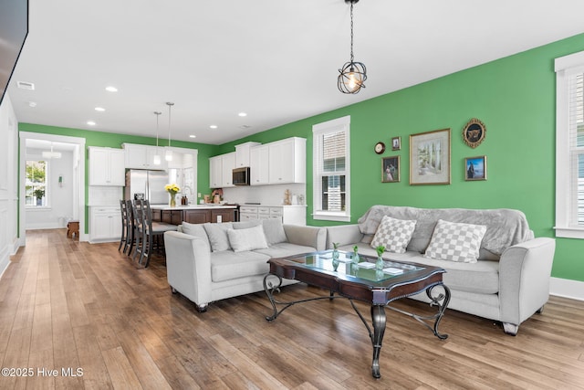 9154 Village Lake Dr SW, Calabash, NC 28467 - living area with light wood-type flooring and recessed lighting