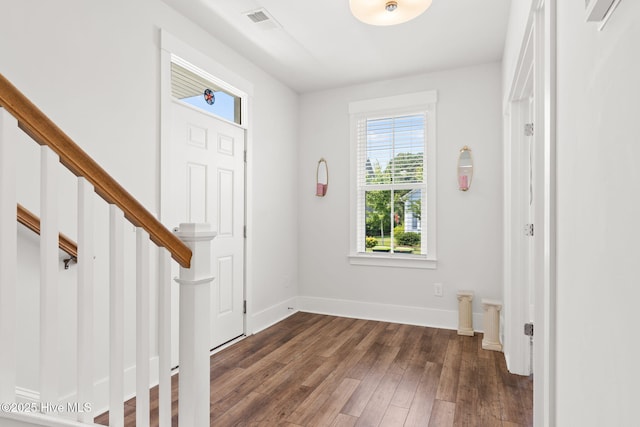 9154 Village Lake Dr SW, Calabash, NC 28467 - foyer entrance with dark wood-type flooring and baseboards