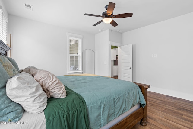 9154 Village Lake Dr SW, Calabash, NC 28467 - bedroom with wood finished floors and a ceiling fan