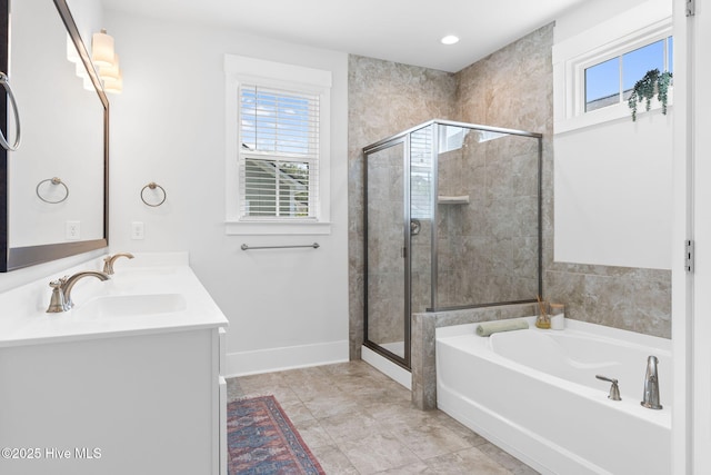 9154 Village Lake Dr SW, Calabash, NC 28467 - full bathroom featuring a garden tub, double vanity, a shower stall, and recessed lighting