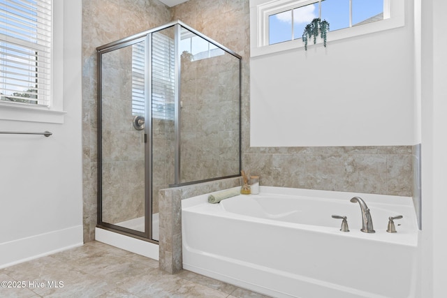 9154 Village Lake Dr SW, Calabash, NC 28467 - bathroom featuring plenty of natural light, a garden tub, and a stall shower