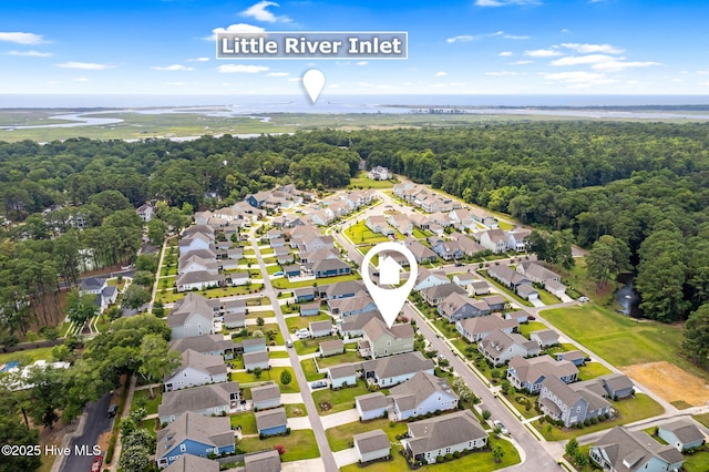 9154 Village Lake Dr SW, Calabash, NC 28467 - aerial overview of property's location with nearby suburban area and a heavily wooded area