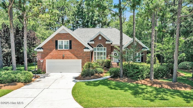 4725 Wedgefield Dr, Wilmington, NC 28409 - view of front facade featuring an attached garage, brick siding, concrete driveway, a front yard, and roof with shingles