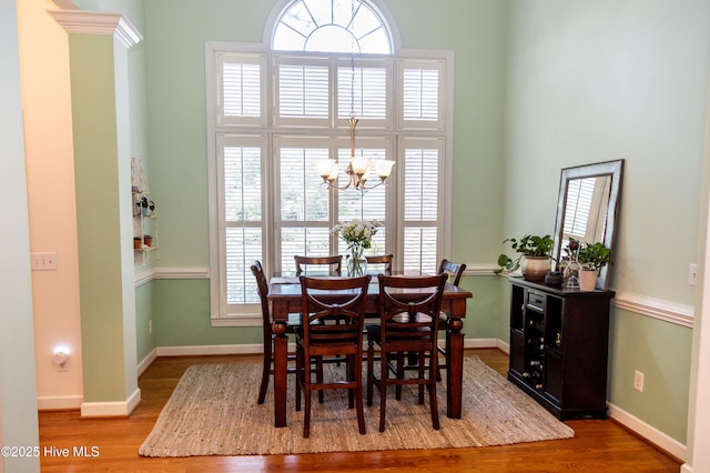 4725 Wedgefield Dr, Wilmington, NC 28409 - dining room featuring a chandelier and wood finished floors