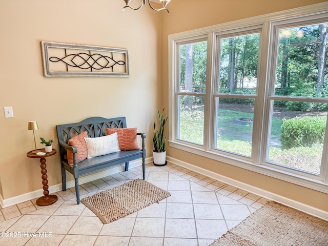 4725 Wedgefield Dr, Wilmington, NC 28409 - living area with light tile patterned flooring, plenty of natural light, and a chandelier