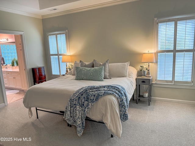 4725 Wedgefield Dr, Wilmington, NC 28409 - carpeted bedroom with crown molding and ensuite bath