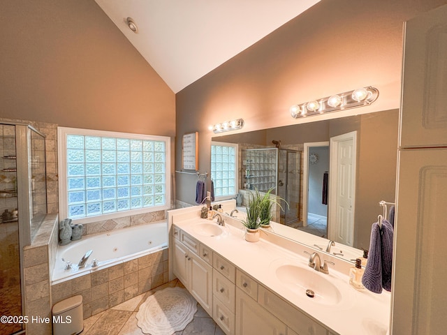 4725 Wedgefield Dr, Wilmington, NC 28409 - full bath featuring a shower stall, a whirlpool tub, double vanity, high vaulted ceiling, and tile patterned floors