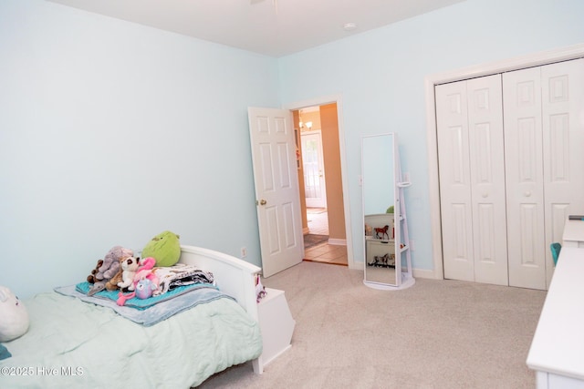 4725 Wedgefield Dr, Wilmington, NC 28409 - bedroom with light colored carpet and a closet
