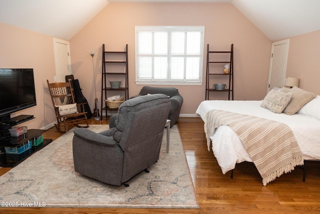 4725 Wedgefield Dr, Wilmington, NC 28409 - bedroom featuring vaulted ceiling and wood finished floors