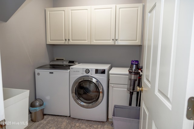 4725 Wedgefield Dr, Wilmington, NC 28409 - laundry room featuring cabinet space and washing machine and clothes dryer