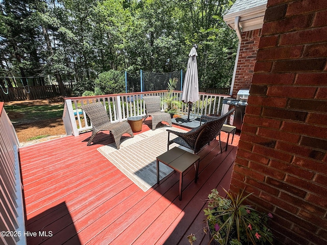 4725 Wedgefield Dr, Wilmington, NC 28409 - deck with grilling area and a fenced backyard