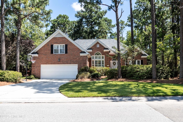 4725 Wedgefield Dr, Wilmington, NC 28409 - view of front of property featuring brick siding, a garage, concrete driveway, and a front lawn