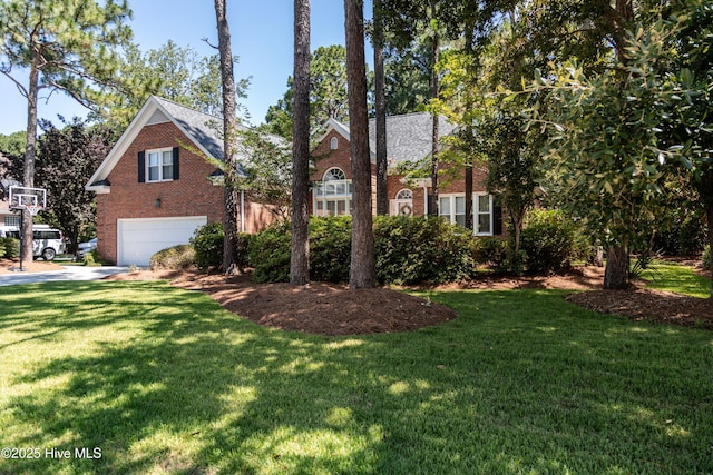 4725 Wedgefield Dr, Wilmington, NC 28409 - view of front of home featuring brick siding, an attached garage, and a front yard