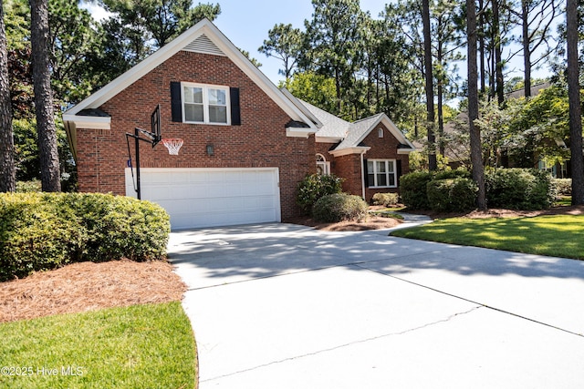 4725 Wedgefield Dr, Wilmington, NC 28409 - traditional home featuring brick siding, a garage, and concrete driveway