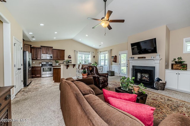 276 Widgeon Way, Lillington, NC 27546 - living room featuring a ceiling fan, lofted ceiling, light carpet, a fireplace with flush hearth, and recessed lighting