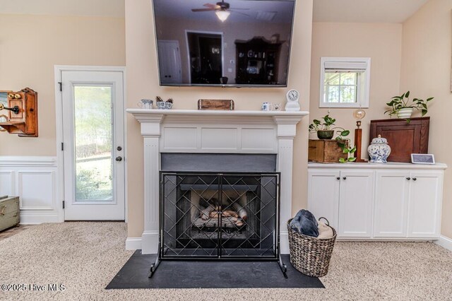 276 Widgeon Way, Lillington, NC 27546 - detailed view of a fireplace with flush hearth, carpet floors, and ceiling fan