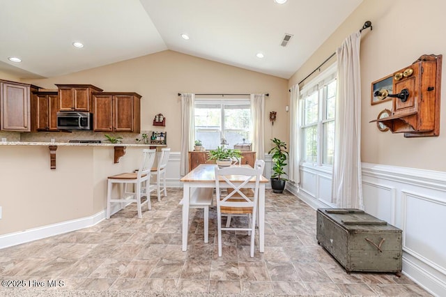 276 Widgeon Way, Lillington, NC 27546 - dining space with lofted ceiling, wainscoting, and recessed lighting