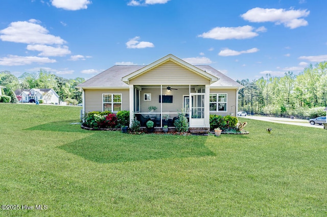 276 Widgeon Way, Lillington, NC 27546 - view of front facade featuring ceiling fan, a front lawn, and a sunroom
