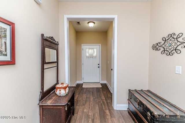 276 Widgeon Way, Lillington, NC 27546 - doorway featuring dark wood-type flooring and baseboards