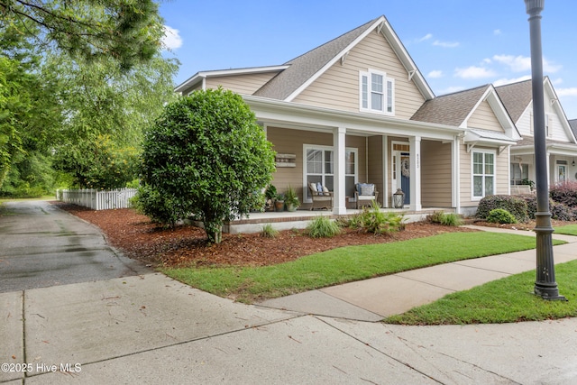 8203 Brays Dr, Wilmington, NC 28411 - view of front facade with covered porch, roof with shingles, and driveway