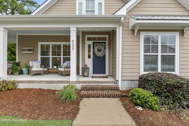 8203 Brays Dr, Wilmington, NC 28411 - doorway to property with covered porch