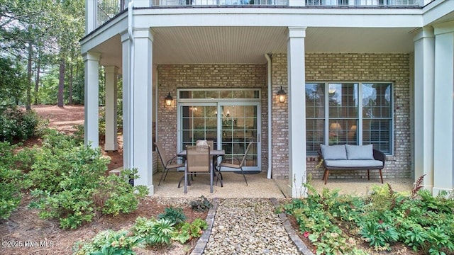 240 Cochrane Castle Cir Unit F, Pinehurst, NC 28374 - doorway to property featuring brick siding and a porch