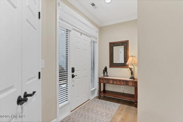 240 Cochrane Castle Cir Unit F, Pinehurst, NC 28374 - foyer with crown molding and wood finished floors