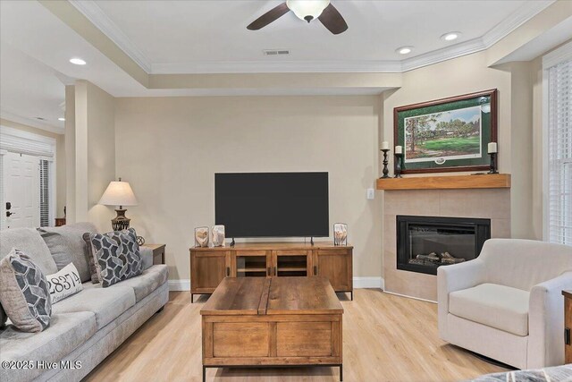 240 Cochrane Castle Cir Unit F, Pinehurst, NC 28374 - living room with light wood finished floors, a glass covered fireplace, ceiling fan, ornamental molding, and recessed lighting