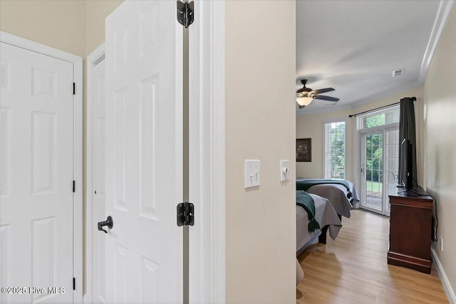 240 Cochrane Castle Cir Unit F, Pinehurst, NC 28374 - bedroom with access to outside, crown molding, light wood-type flooring, and ceiling fan