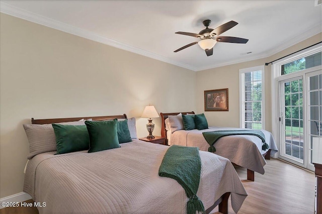 240 Cochrane Castle Cir Unit F, Pinehurst, NC 28374 - bedroom featuring access to exterior, ornamental molding, light wood-style flooring, and ceiling fan