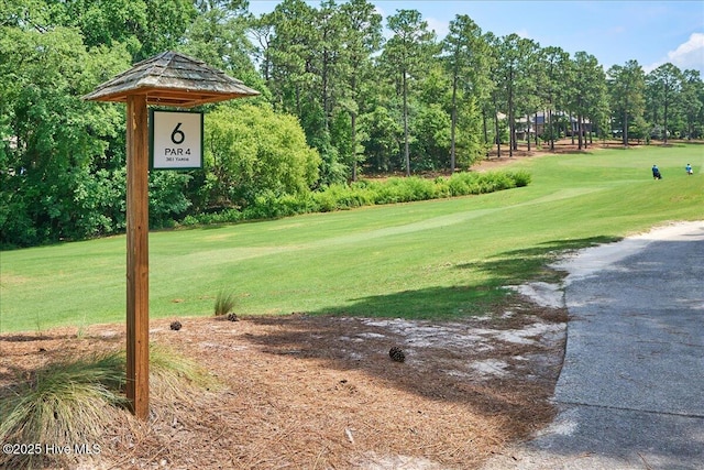 240 Cochrane Castle Cir Unit F, Pinehurst, NC 28374 - view of green lawn with view of golf course and view of wooded area