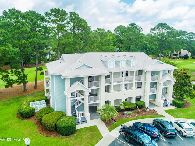 330 S Middleton Dr NW Unit 1009, Calabash, NC 28467 - view of property featuring uncovered parking and stairs