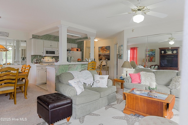 330 S Middleton Dr NW Unit 1009, Calabash, NC 28467 - living room with decorative columns, ceiling fan, and light carpet