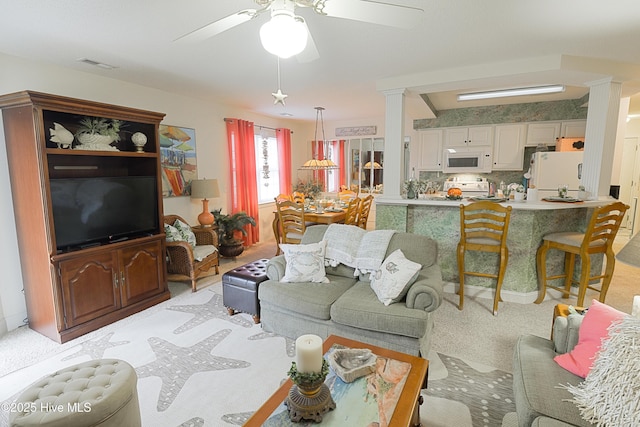 330 S Middleton Dr NW Unit 1009, Calabash, NC 28467 - living room featuring ceiling fan, light carpet, and decorative columns