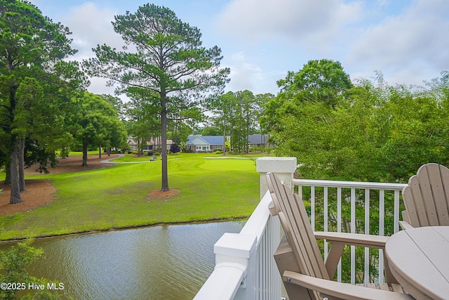 330 S Middleton Dr NW Unit 1009, Calabash, NC 28467 - dock area featuring a water view and a lawn
