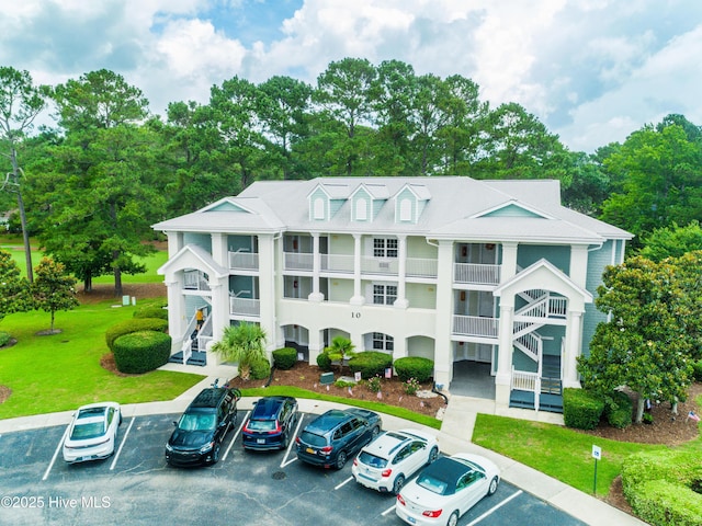 330 S Middleton Dr NW Unit 1009, Calabash, NC 28467 - view of property with uncovered parking and stairway
