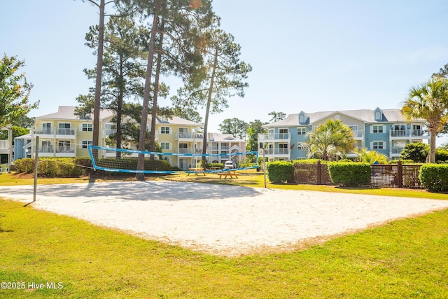 330 S Middleton Dr NW Unit 1009, Calabash, NC 28467 - view of community featuring volleyball court and a residential view