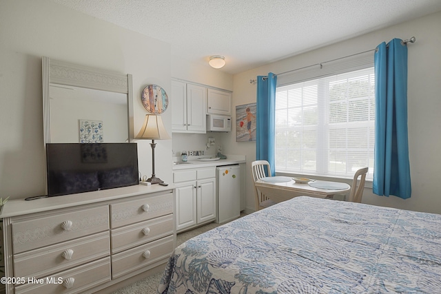 330 S Middleton Dr NW Unit 1009, Calabash, NC 28467 - bedroom featuring a textured ceiling