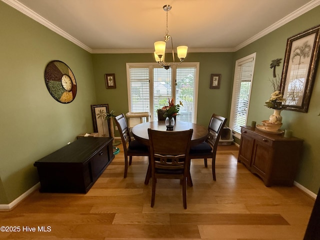 2834 Lancaster Rd NW, Wilson, NC 27896 - dining room featuring a chandelier, crown molding, and light wood-type flooring