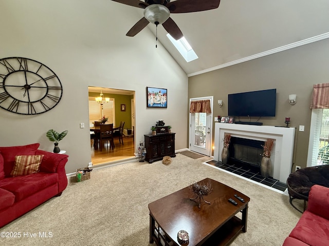 2834 Lancaster Rd NW, Wilson, NC 27896 - living room featuring carpet, ceiling fan, high vaulted ceiling, a chandelier, and a tile fireplace