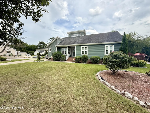 2834 Lancaster Rd NW, Wilson, NC 27896 - view of front facade with a front lawn, a shingled roof, and covered porch