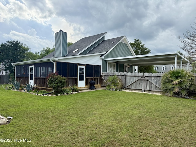 2834 Lancaster Rd NW, Wilson, NC 27896 - rear view of property with a sunroom, a chimney, and a shingled roof