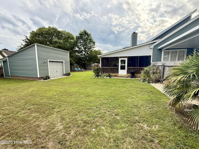2834 Lancaster Rd NW, Wilson, NC 27896 - view of yard with a sunroom, an outdoor structure, and a detached garage