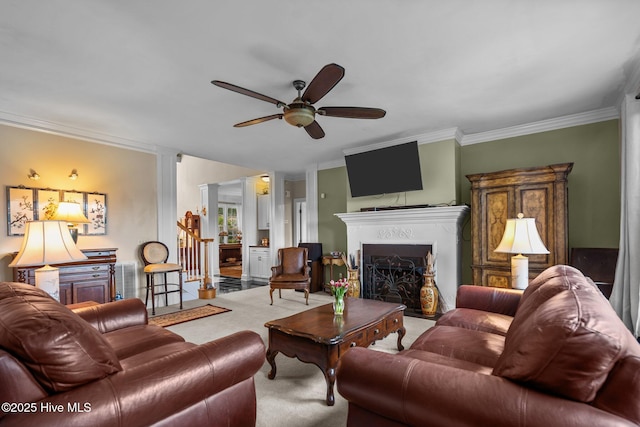 6122 Timber Creek Ln, Wilmington, NC 28411 - carpeted living area with a ceiling fan, ornamental molding, and a fireplace with flush hearth