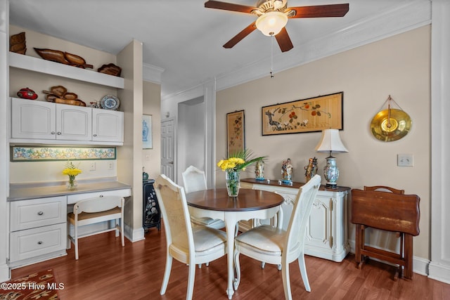 6122 Timber Creek Ln, Wilmington, NC 28411 - dining room featuring a ceiling fan, crown molding, wood finished floors, and built in study area