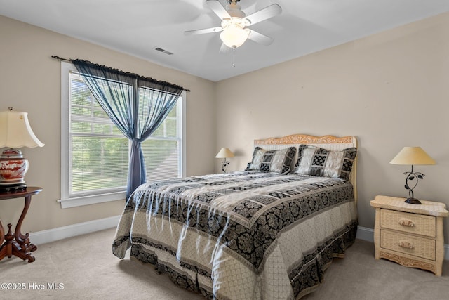 6122 Timber Creek Ln, Wilmington, NC 28411 - carpeted bedroom featuring multiple windows and ceiling fan
