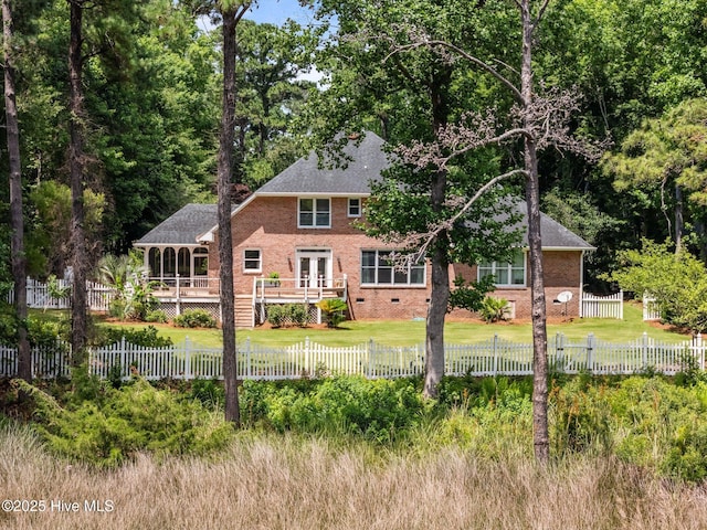 6122 Timber Creek Ln, Wilmington, NC 28411 - back of house featuring a deck, brick siding, a fenced front yard, and crawl space