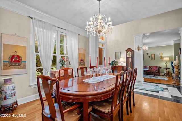6122 Timber Creek Ln, Wilmington, NC 28411 - dining space featuring wood finished floors, a chandelier, and ornamental molding